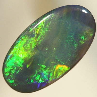 SOLID BLACK OPAL Golden gem fire, oranges and greens with a touch of blue. SEE VIDEO